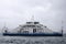 Passenger ferry crosses the Bosporus strait in Istanbul, Turkey in stormy and rainy day