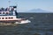 Passenger Ferry crossing lake to Ometepe Island where you can see Conception volcano rising in the background