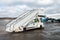 Passenger gangway next to aircraft at the airport