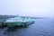 Passenger hydrofoil boat on the docks of Onego lake in foggy weather.