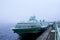 Passenger hydrofoil boat on the docks of Onego lake in foggy weather.