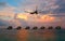 Passenger jet airliner plane arriving or departing Maldives resort