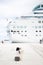 Passenger photographing big cruise ship