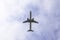 passenger plane against the background of clouds the bottom view