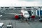 Passenger plane boarding passengers by jet bridge