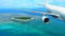 Passenger Plane Flies Over Tropical Island