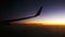 Passenger Plane in Flight Against a Background of Sunset