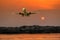 Passenger plane in flight. Aircraft fly high in the sky above the clouds. Front view of airplane