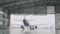 Passenger plane maintenance engines and fuselage repair leaves the hangar of the airport. Airbus for maintenance in the