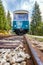 A passenger railway wagon in a low perspective.