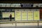 Passenger reads timetable at Brugge Railway Station, Belgium