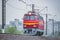 Passenger retro electric czech locomotive under the rain