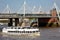 Passenger service on River Thames cruise under Hungerford Bridge