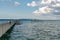 Passenger ship arrives at the Altnau pier with people walking to and fro from the port station