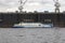 Passenger ship moves opposite the floating dock. The Neva River