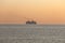 Passenger ship at orange sunset