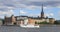 Passenger ship passes by buildings of Old Town in Stockholm