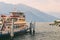 Passenger ship on a regular route across lake Comno ready to leave the quay.