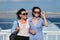 Passenger shipping, mother and teen daughter on deck of ferry