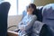 Passenger shipping, woman sitting in cabin of comfortable sea ferry