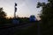 Passenger train led by locomotive EP1M passing by an entrance signal in rural area, Russia.