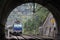 Passenger train locomotive entering a tunnel
