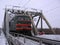 Passenger train speeds along the tracks, the railway through the tunnel in winter