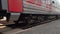 Passenger train is traveling by rail. Close-up of wagon wheels on railway. Transport and freight concept