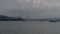 Passenger travel through water lake by traditional Thai wooden long tail boat