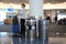 A passenger waits near trash and recycling bins at Los Angeles International Airport LAX