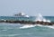 Passenger yacht speeds along the ocean.