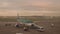 Passengers boarding plane at Dublin airport at dawn