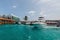 Passengers are brought on speed boats to the Ibrahim Nasir International Airport in Male, Maldives