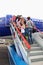 Passengers climb the ladder to board the airship.