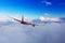 Passengers commercial airplane flying above clouds