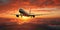 Passengers commercial airplane flying above clouds in sunset light.