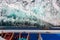 Passengers on the deck of cruise ship looking at andaman sea, top view. Waves blured