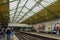 Passengers at the historic Edwardian platforms of Ealing Broadway