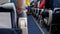 Passengers inside the cabin of passenger aircraft sitting on the chairs during the flight