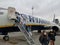 Passengers leave a plane of the Irish airline Ryanair