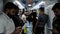 Passengers, mostly migrant workers, ride the subway and look at their phones. Dubai, January 2019