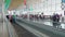Passengers moving on escalator at Madrid Airport