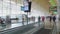 Passengers moving on escalator at Madrid Airport