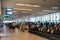 Passengers queue at the boarding gate waiting for the boarding time start