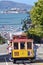 Passengers riding on Cable Car No. 15 with Alcatraz Island in th