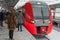 Passengers standing on platform near train. Moscow.