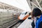 Passengers taking some photos of Taiwan High Speed Train with mobile phone while the train moving to platform in Taiwan, Taipei