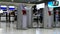 Passengers using self service kiosks at Narita International Airport Japan.