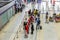 Passengers wait in line to check in their flight at Don Muang International Airport check in counters in Bangkok, Thailand