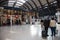 Passengers waiting at York Railways station by Train Information display showing train times, arivals and departures